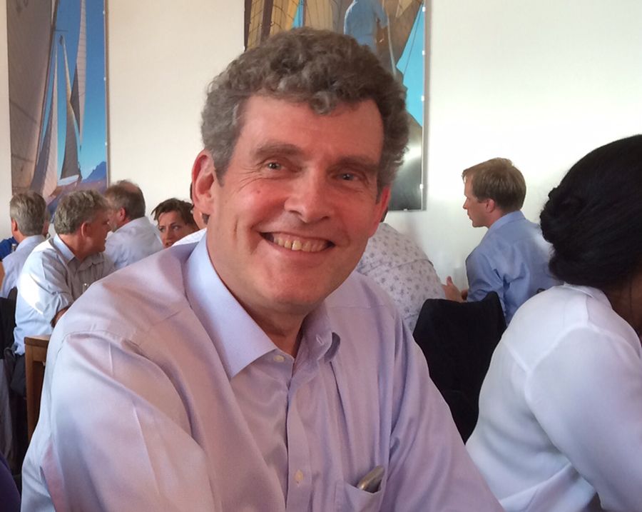 Headshot of David McKeown showing a man smiling into the camera