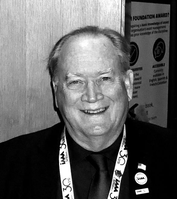 Headshot of Joe Mooney at an IAM event, smiling into camera