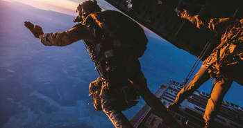 A Hercules plane on a runway at night